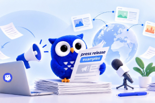 Blue owl mascot reading a newspaper with 
